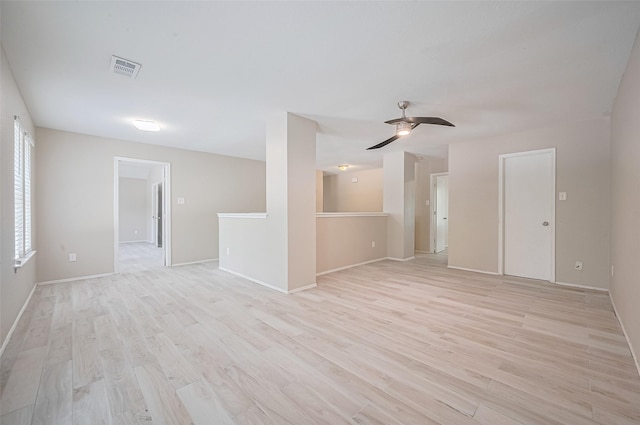 16502 N Glade Dr, Houston, TX 77073 - empty room featuring light wood-style floors, ceiling fan, and baseboards