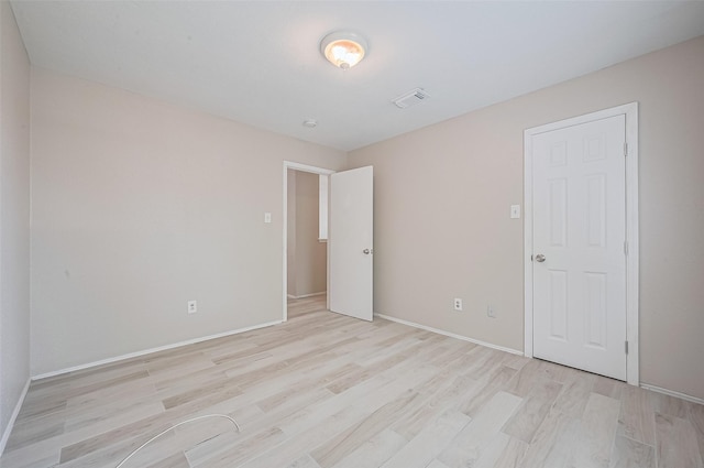 16502 N Glade Dr, Houston, TX 77073 - unfurnished bedroom with light wood finished floors and baseboards