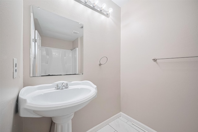 16502 N Glade Dr, Houston, TX 77073 - full bathroom with baseboards and a sink