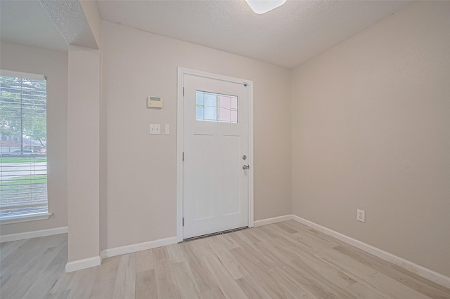 16502 N Glade Dr, Houston, TX 77073 - entrance foyer featuring light wood-style flooring, healthy amount of natural light, and baseboards