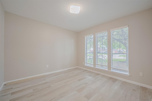 16502 N Glade Dr, Houston, TX 77073 - empty room with baseboards and light wood finished floors