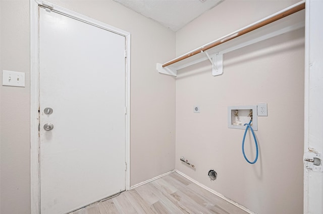 16502 N Glade Dr, Houston, TX 77073 - laundry room featuring washer hookup, hookup for a gas dryer, light wood-style floors, and hookup for an electric dryer