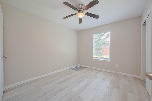 16502 N Glade Dr, Houston, TX 77073 - unfurnished bedroom with light wood finished floors, baseboards, ceiling fan, and a closet