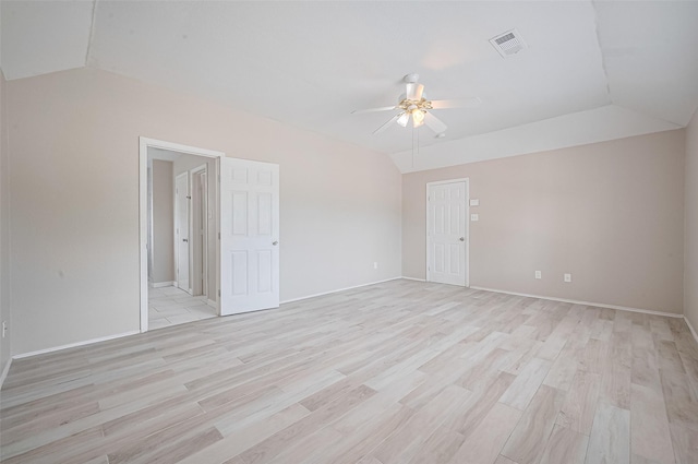 16502 N Glade Dr, Houston, TX 77073 - empty room featuring a ceiling fan, vaulted ceiling, light wood-style floors, and baseboards