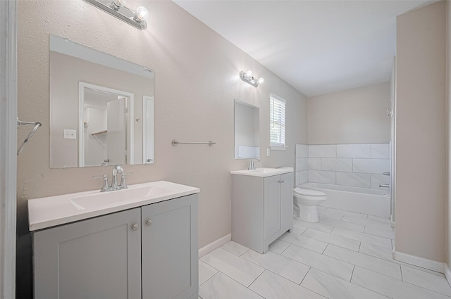 16502 N Glade Dr, Houston, TX 77073 - bathroom featuring vanity, toilet, a bathtub, baseboards, and tile patterned flooring