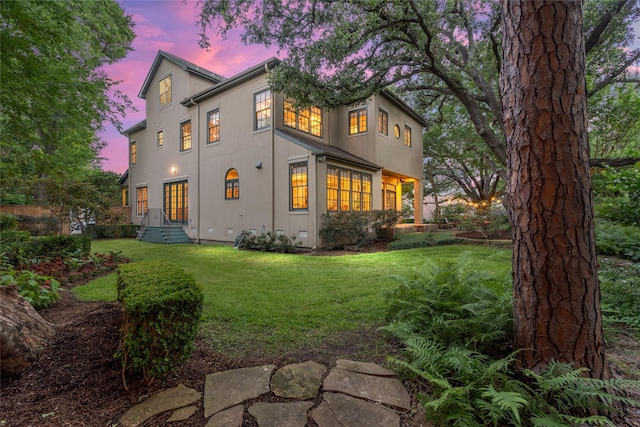 3502 Underwood St, Houston, TX 77025 - rear view of house with a lawn and stucco siding