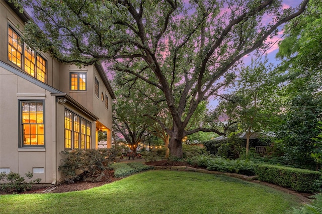 3502 Underwood St, Houston, TX 77025 - yard at dusk featuring a lawn