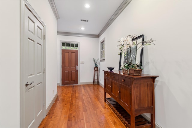 3502 Underwood St, Houston, TX 77025 - entrance foyer featuring ornamental molding, light wood-style flooring, and recessed lighting