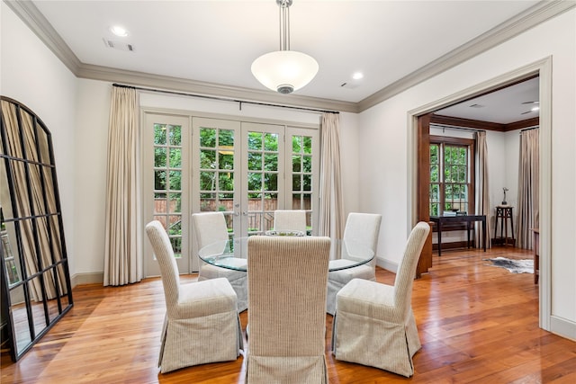 3502 Underwood St, Houston, TX 77025 - dining area with crown molding, french doors, light wood-style flooring, and recessed lighting