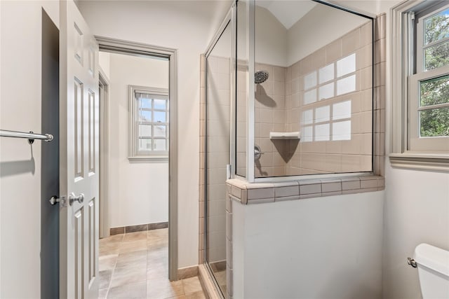 3502 Underwood St, Houston, TX 77025 - bathroom featuring tiled shower and healthy amount of natural light