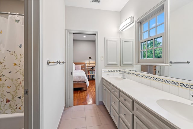 3502 Underwood St, Houston, TX 77025 - full bathroom with double vanity, connected bathroom, tile patterned floors, and shower / bath combination with curtain