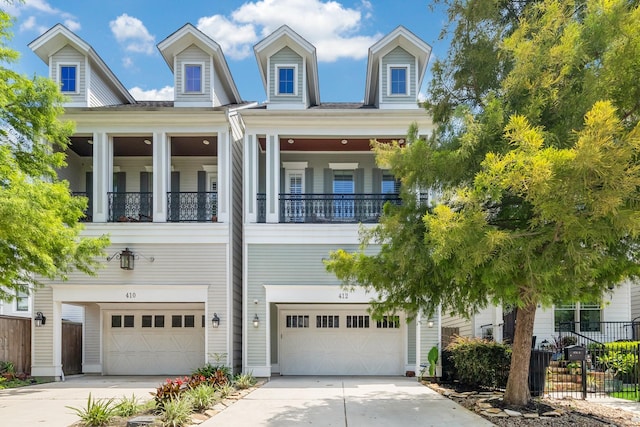 412 W 24th St, Houston, TX 77008 - view of front facade with an attached garage, driveway, and a balcony