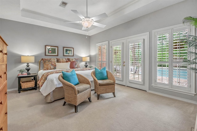 3008 Cochise Ct, College Station, TX 77845 - bedroom featuring carpet flooring, access to exterior, a raised ceiling, and a ceiling fan