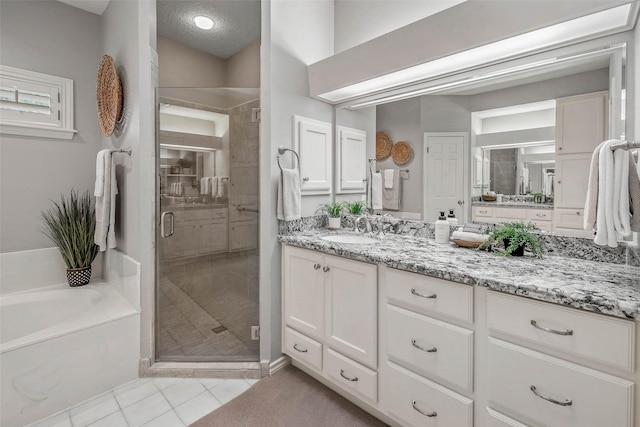 3008 Cochise Ct, College Station, TX 77845 - full bath with a bath, tile patterned flooring, vanity, and a shower stall