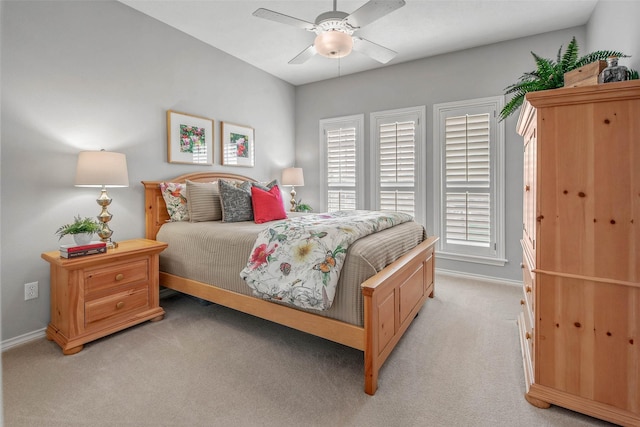 3008 Cochise Ct, College Station, TX 77845 - bedroom featuring baseboards, light carpet, and a ceiling fan