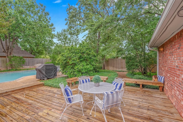 3008 Cochise Ct, College Station, TX 77845 - wooden deck featuring a fenced backyard, outdoor dining space, and grilling area