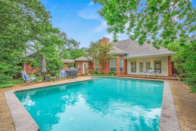 3008 Cochise Ct, College Station, TX 77845 - outdoor pool with french doors and grilling area