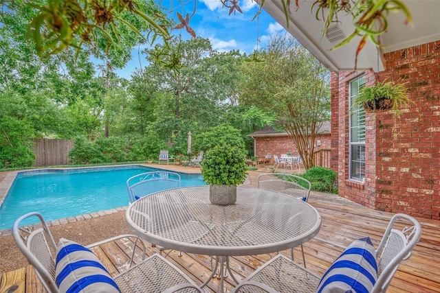 3008 Cochise Ct, College Station, TX 77845 - view of pool with a deck, view of wooded area, and outdoor dining space