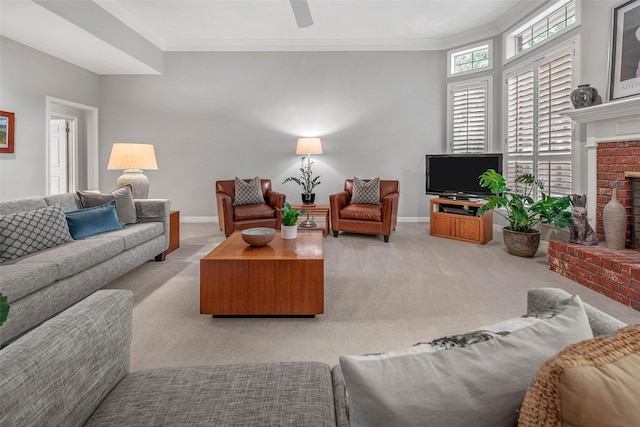 3008 Cochise Ct, College Station, TX 77845 - carpeted living room with a fireplace, baseboards, a ceiling fan, and crown molding