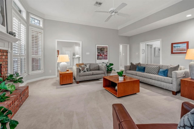 3008 Cochise Ct, College Station, TX 77845 - living area featuring carpet floors, ornamental molding, a ceiling fan, a fireplace, and baseboards