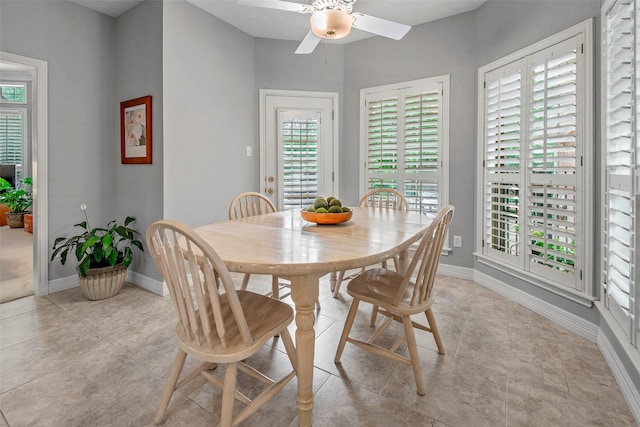 3008 Cochise Ct, College Station, TX 77845 - dining room featuring a ceiling fan, baseboards, and light tile patterned flooring