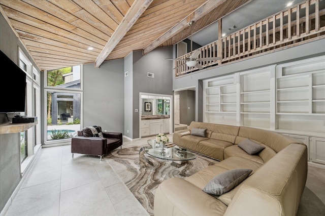 2411 Oakbank Dr, Houston, TX 77339 - living area with wooden ceiling with exposed beams, high vaulted ceiling, light tile patterned floors, and baseboards