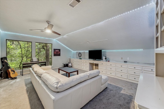 2411 Oakbank Dr, Houston, TX 77339 - living area with light colored carpet, lofted ceiling, and a ceiling fan