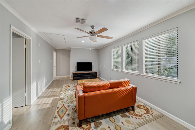 2411 Oakbank Dr, Houston, TX 77339 - living area featuring attic access, wood finished floors, a ceiling fan, ornamental molding, and baseboards