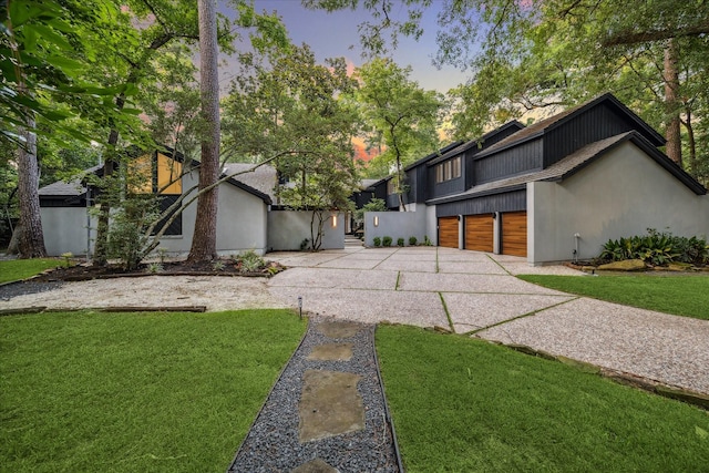 2411 Oakbank Dr, Houston, TX 77339 - view of front facade with driveway and a yard