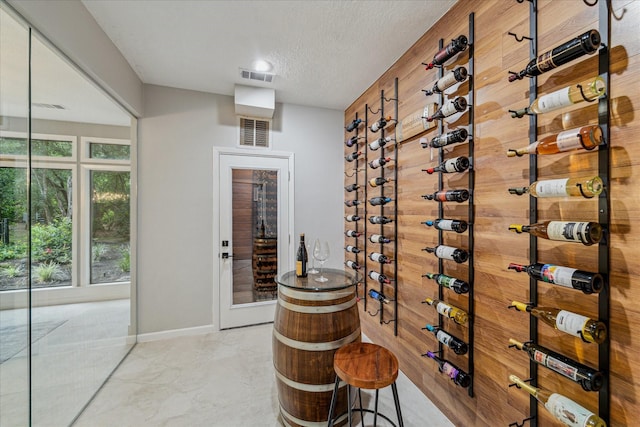 2411 Oakbank Dr, Houston, TX 77339 - wine area featuring a textured ceiling and baseboards