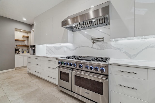 2411 Oakbank Dr, Houston, TX 77339 - kitchen featuring range with two ovens, ventilation hood, modern cabinets, white cabinets, and recessed lighting