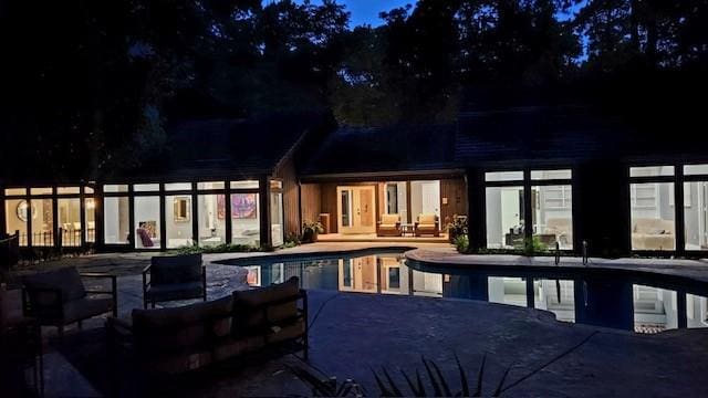 2411 Oakbank Dr, Houston, TX 77339 - indoor pool with a patio area and an outdoor hangout area
