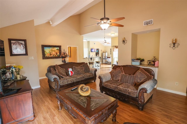 13555 Portobello Dr, Houston, TX 77083 - living area with a ceiling fan, wood finished floors, baseboards, beam ceiling, and high vaulted ceiling