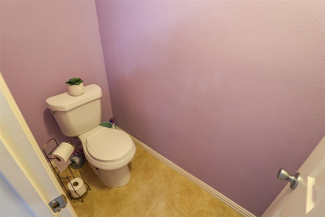 13555 Portobello Dr, Houston, TX 77083 - bathroom featuring toilet, tile patterned flooring, and baseboards