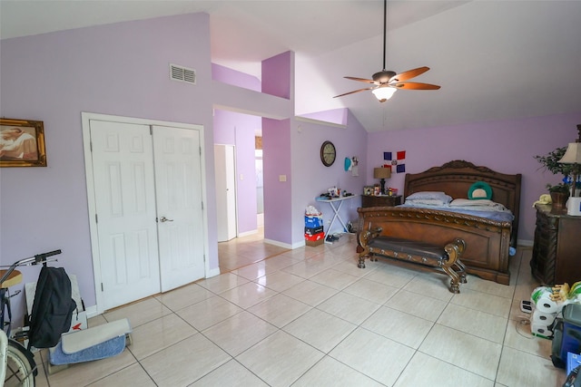 13555 Portobello Dr, Houston, TX 77083 - bedroom featuring light tile patterned floors, baseboards, high vaulted ceiling, a ceiling fan, and a closet