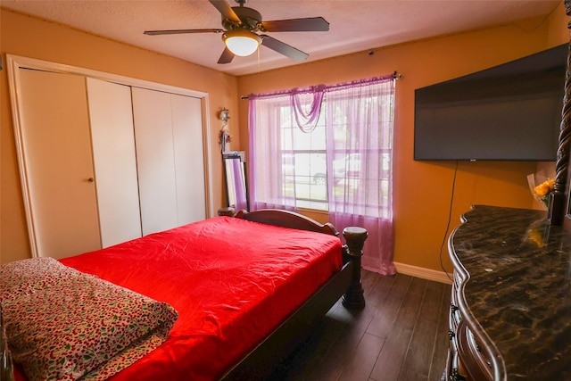 13555 Portobello Dr, Houston, TX 77083 - bedroom with baseboards, dark wood finished floors, a closet, and ceiling fan