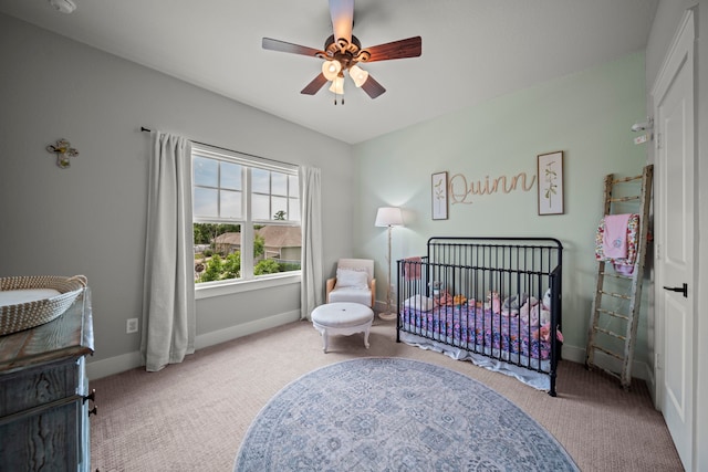30 Burgess Bend Way, The Woodlands, TX 77389 - carpeted bedroom featuring a nursery area, baseboards, and a ceiling fan