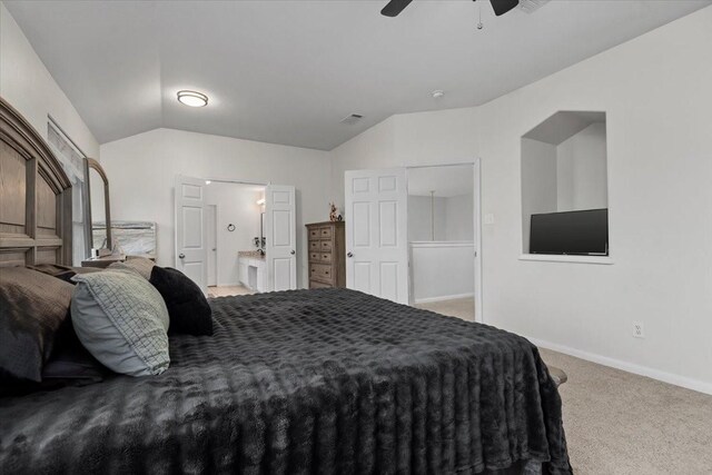 8731 Majesticbrook Dr, Houston, TX 77095 - bedroom with lofted ceiling, carpet floors, baseboards, ceiling fan, and ensuite bath