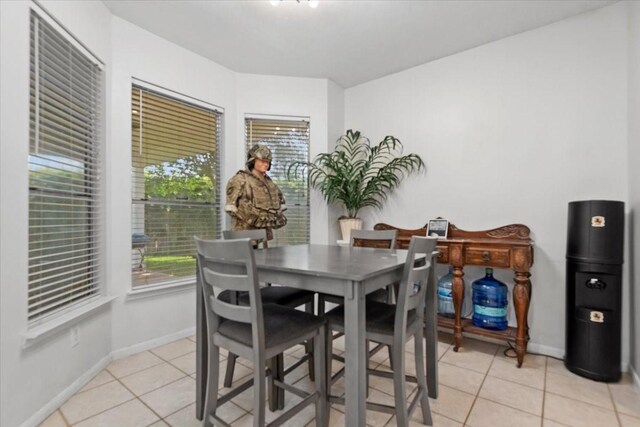 8731 Majesticbrook Dr, Houston, TX 77095 - dining room featuring light tile patterned floors and baseboards