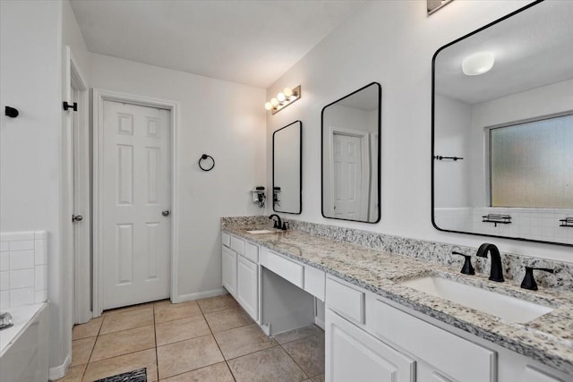 8731 Majesticbrook Dr, Houston, TX 77095 - full bath with double vanity, a bath, and tile patterned flooring
