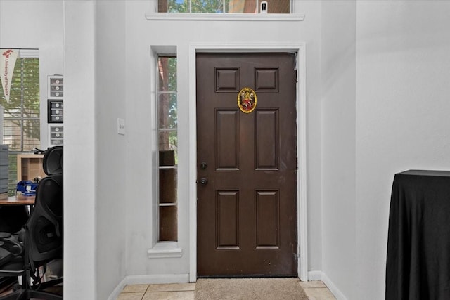 8731 Majesticbrook Dr, Houston, TX 77095 - entryway with baseboards and light tile patterned floors