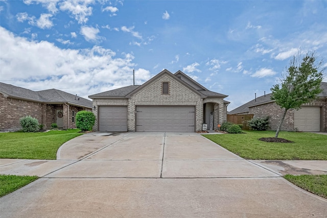 1214 Red Hills Dr, Rosharon, TX 77583 - view of front of property featuring brick siding, an attached garage, a front yard, driveway, and roof with shingles
