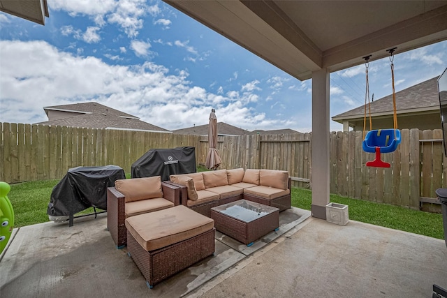 1214 Red Hills Dr, Rosharon, TX 77583 - fenced backyard featuring a patio, an outdoor living space, and a grill
