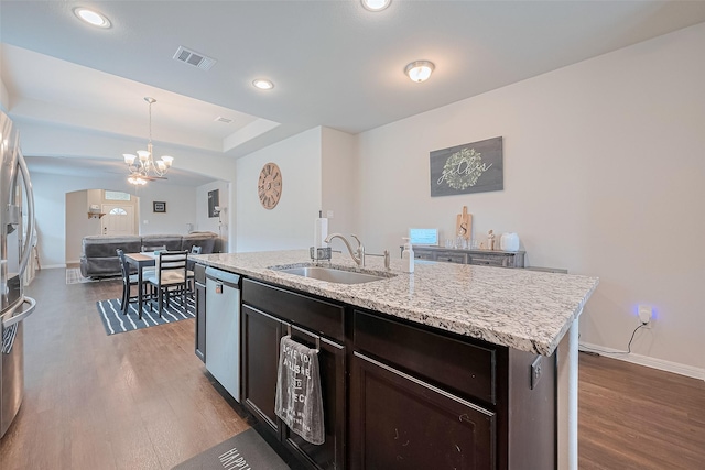 1214 Red Hills Dr, Rosharon, TX 77583 - kitchen with a sink, wood finished floors, a chandelier, dishwasher, and recessed lighting