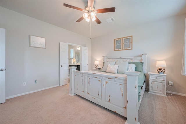 1214 Red Hills Dr, Rosharon, TX 77583 - bedroom featuring light carpet, baseboards, ensuite bath, and ceiling fan