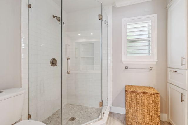 2502 Briarbrook Dr, Houston, TX 77042 - full bath featuring a shower stall, toilet, and baseboards