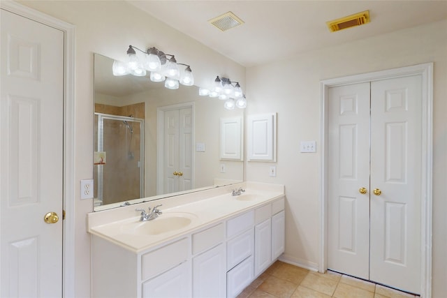 3606 Kilgore Ct, Manvel, TX 77578 - bathroom with double vanity, a stall shower, tile patterned flooring, and baseboards