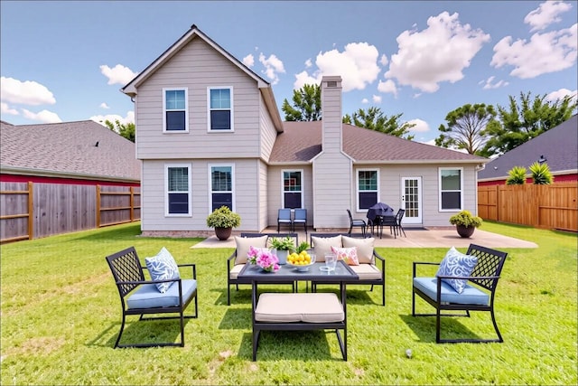 3606 Kilgore Ct, Manvel, TX 77578 - back of property with a chimney, a patio, and outdoor lounge area