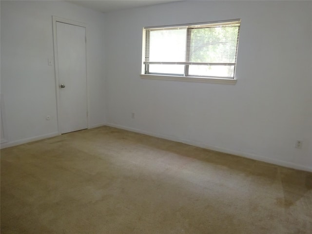 4810 Theall Rd, Houston, TX 77066 - empty room featuring light carpet and baseboards