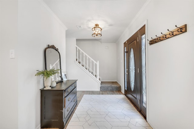 16202 Elm Point Ct, Houston, TX 77095 - foyer entrance featuring ornamental molding, stairway, a chandelier, light tile patterned floors, and baseboards